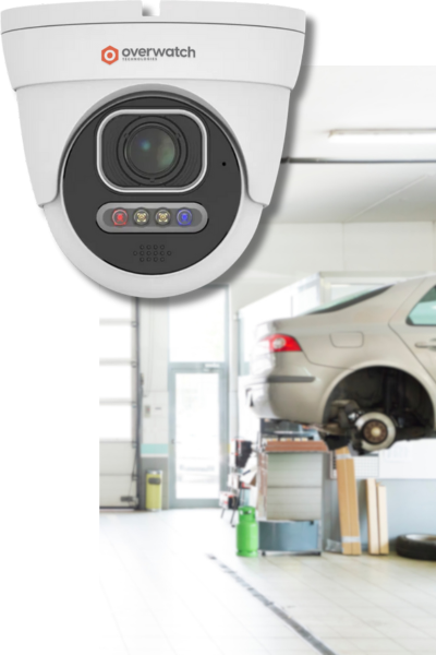 image showing a video camera with an autobody shop in the background, one of the types of auto industry businesses Overwatch can provide security for