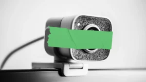 Blog thumbnail showing a camera with tape over it to represent security system downtime